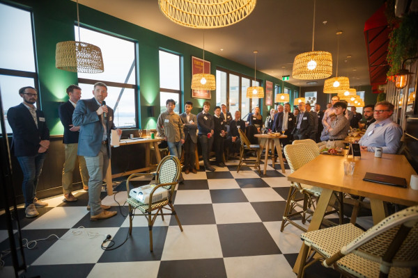 Speakers and attendees at a Bitcoin event in Wellington, New Zealand
